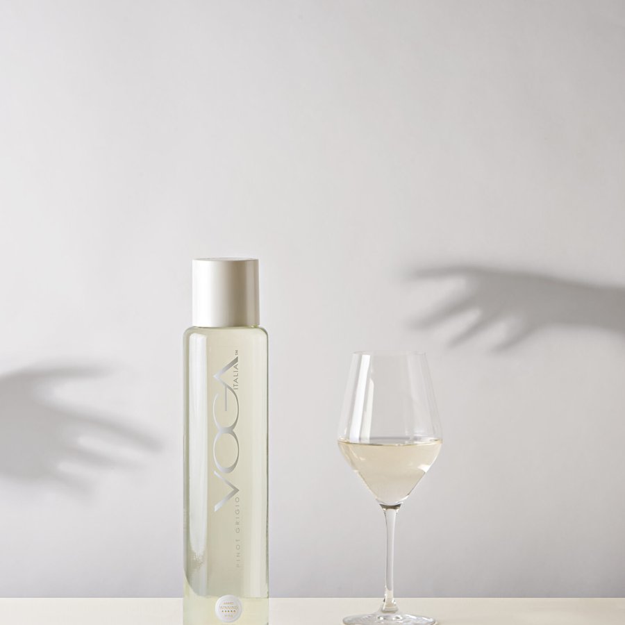 VOGA bottle and glass among shadows