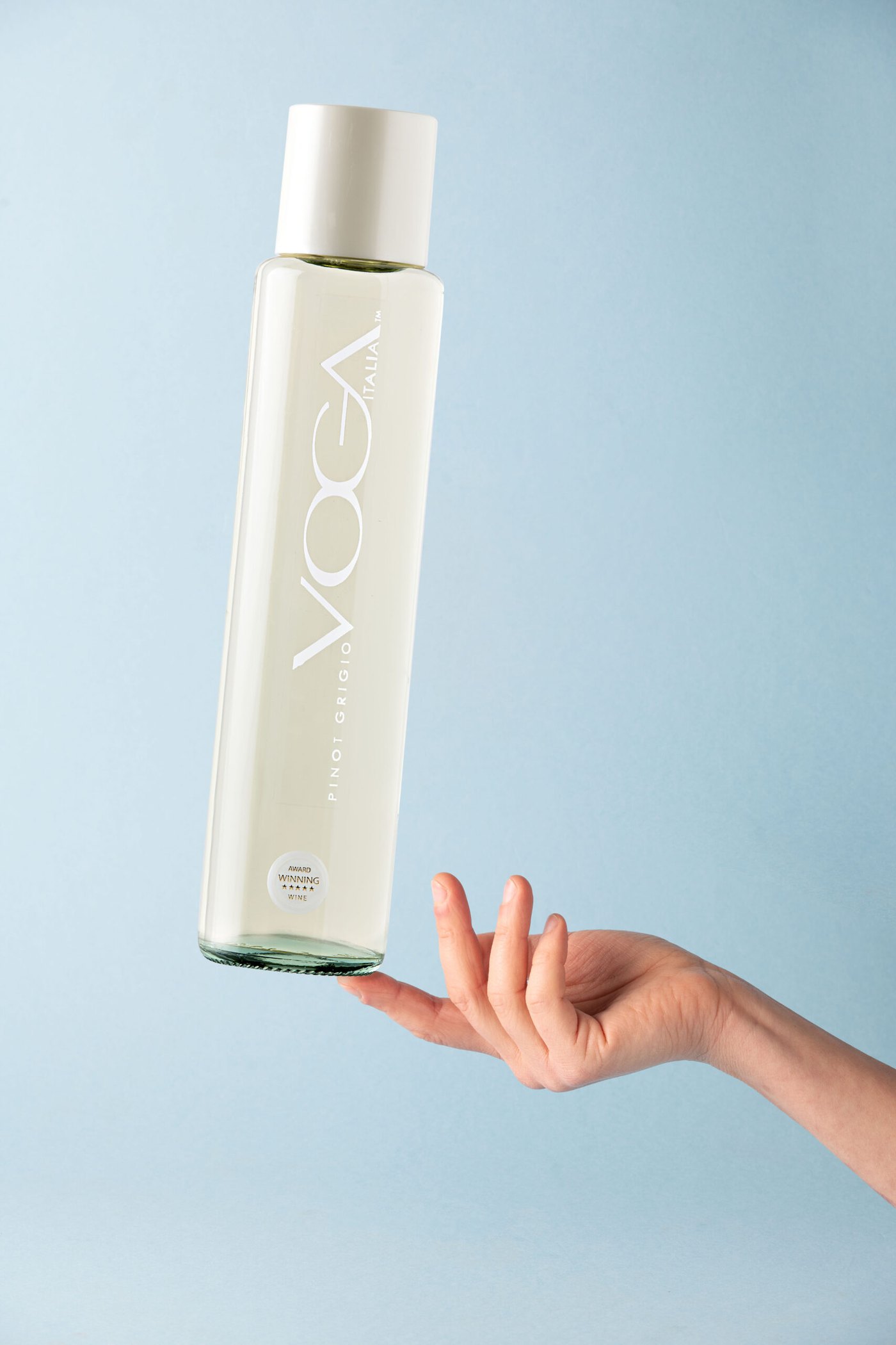 The VOGA cylindrical bottle held in a hand
